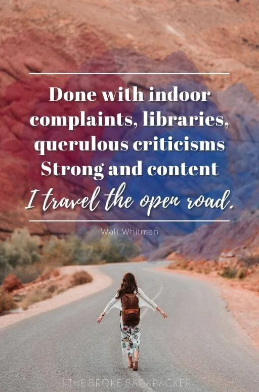 A lone traveler walking down an endless desert highway under a clear sky